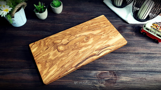 olive wood cutting board on the table